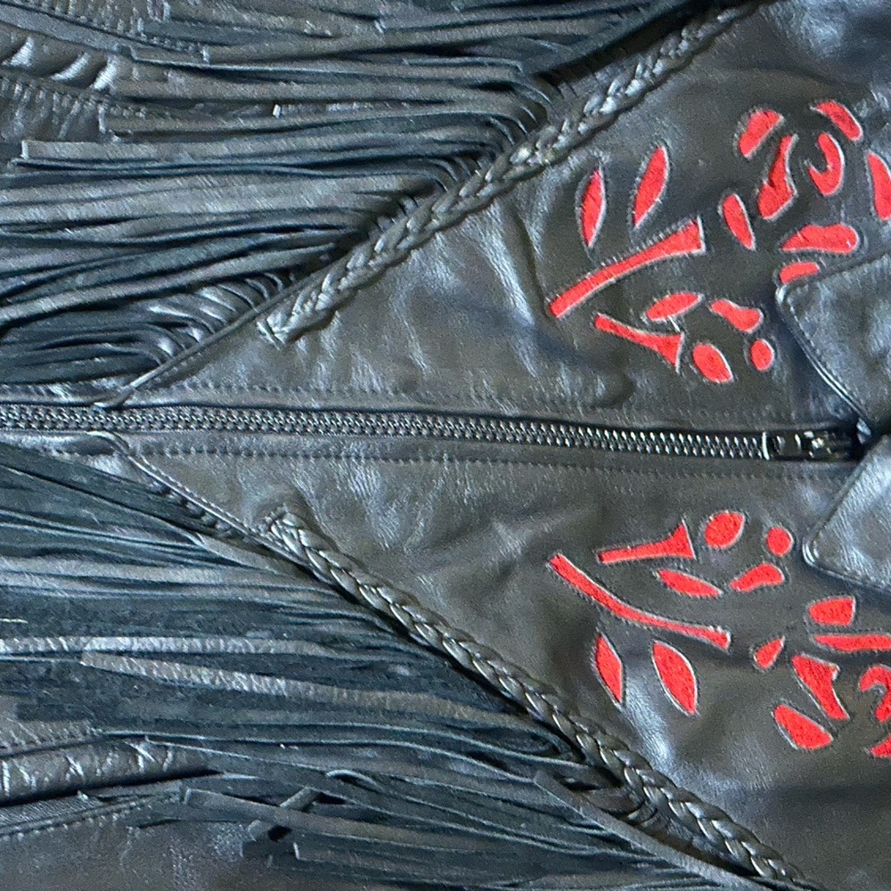 Woman’s leather suit 3 piece sold all together vest,chaps,leather jacket